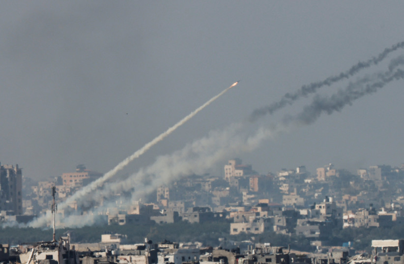  Rockets are launched from the Gaza Strip into Israel, after a temporary truce expired between Israel and the Palestinian terrorist group Hamas, as seen from Israel's border with Gaza in southern Israel, December 1, 2023. (credit: AMIR COHEN/REUTERS)