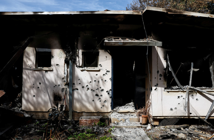  A view shows the remains of a burnt home with its bullet-riddled exterior, following a deadly infiltration by Hamas gunmen from the Gaza Strip, in Kibbutz Kissufim in southern Israel October 21, 2023. (credit: REUTERS/AMIR COHEN)