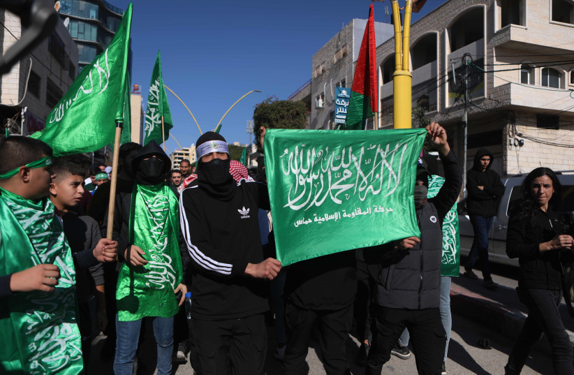  Hamas supporters take part in a protest in support of the people of Gaza in Hebron, West Bank, December 1, 2023 (credit: WISAM HASHLAMOUN/FLASH90)
