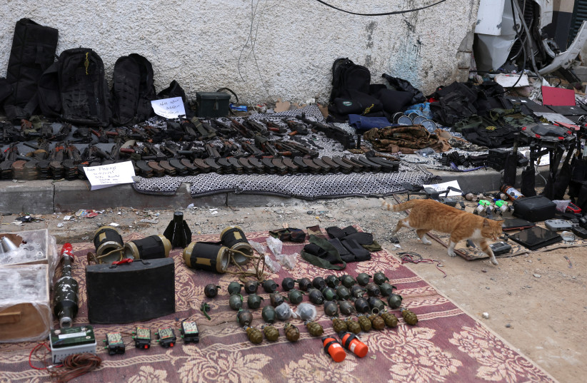 Weapons that, according to Israel's miliitary, were found at Al Shifa Hospital compound in Gaza City, amid the ongoing ground operation of the Israeli army against Palestinian terrorist group Hamas, in the Gaza Strip, November 22, 2023.  (credit: REUTERS/Ronen Zvulun)