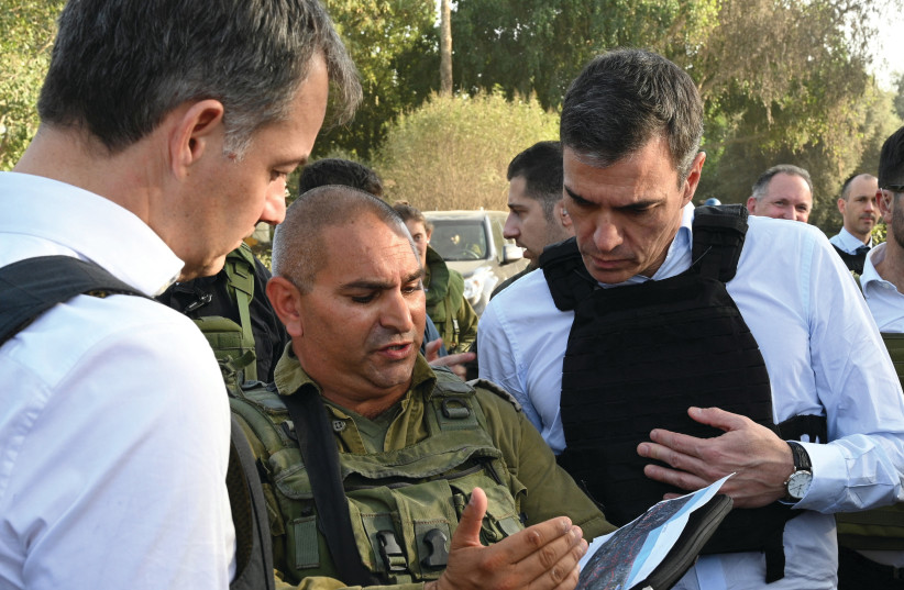  SPANISH PRIME Minister Pedro Sanchez (left) and his Belgian counterpart, Alexander de Croo, visit Kibbutz Be’eri, last month.  (credit: MONCLOA PALACE/REUTERS)
