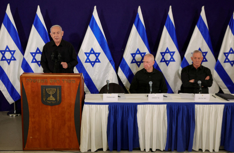  Israeli Prime Minister Benjamin Netanyahu, with Defense Minister Yoav Gallant and Cabinet minister Benny Gantz, speaks during a press conference in the Kirya military base in Tel Aviv, Israel, 28 October 2023 (credit: ABIR SULTAN/POOL/VIA REUTERS)