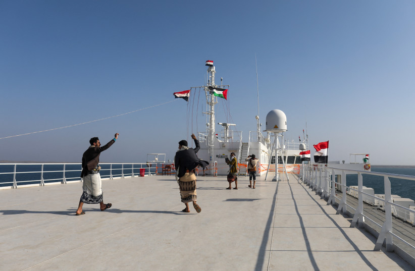  People dance on the deck of the Galaxy Leader commercial ship, seized by Yemen's Houthis last month, off the coast of al-Salif, Yemen December 5, 2023 (credit: REUTERS/KHALED ABDULLAH)