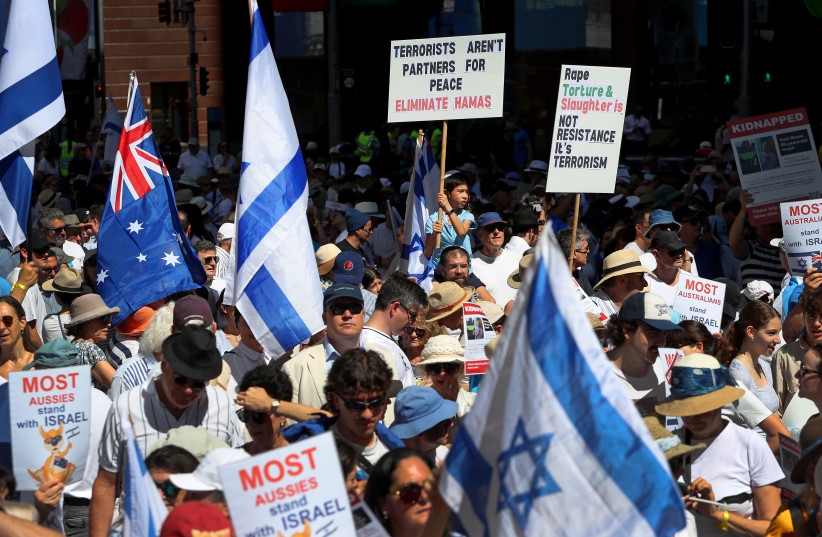  PEOPLE TAKE PART in a ‘United With Israel - Bring Them Home’ protest in Sydney last month.  (credit: LISA MAREE WILLIAMS/GETTY IMAGES)