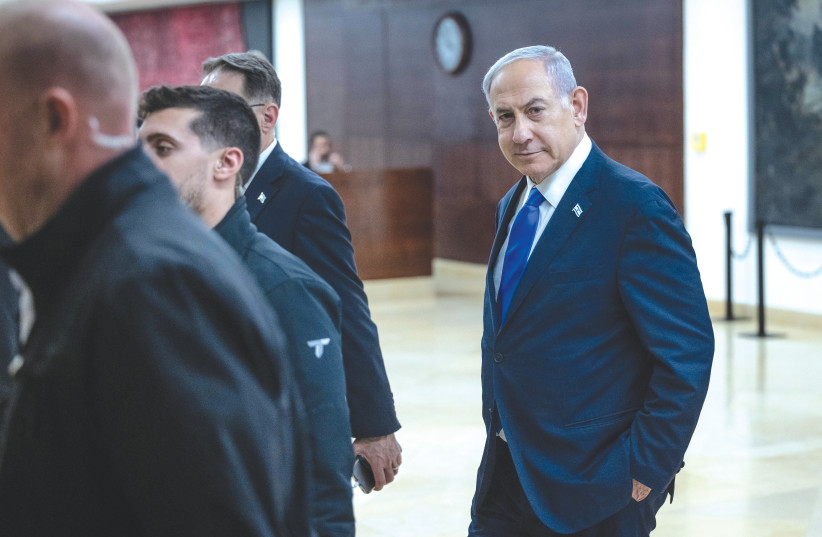  Prime Minister Benjamin Netanyahu walks from his office in the Knesset, last week. In the US, there are deepening political divisions over the strong American support for Israel during the current war, says the writer. (credit: CHAIM GOLDBEG/FLASH90)