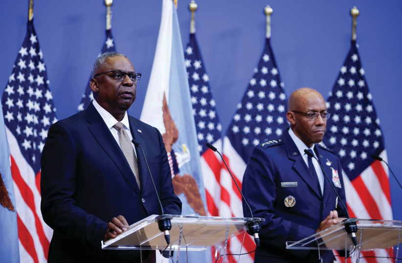  US Defense Secretary Lloyd Austin and Chairman of the Joint Chiefs of Staff Gen. Charles Q. Brown hold a news conference during a meeting of NATO defense ministers in Brussels, in October. (credit: JOHANNA GERON/REUTERS)
