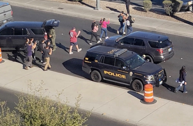  Students and faculty evacuate to safety following a shooting at UNLV. (credit: REUTERS)