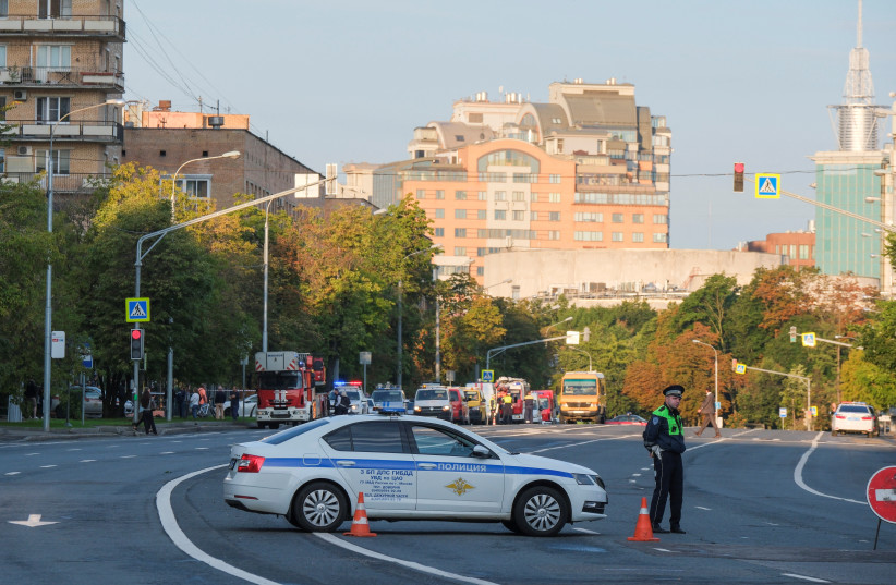  A police officer blocks a road following a reported drone attack in central Moscow, Russia July 24, 2023. (credit: REUTERS/SHAMIL ZHUMATOV)