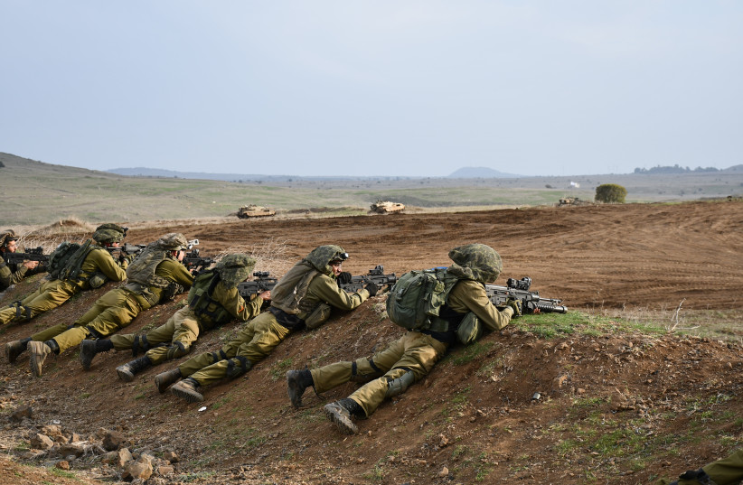  IDF soldiers of the Alexandroni Brigade train in the Golan Heights, December 2023 (credit: SETH J. FRANTZMAN)