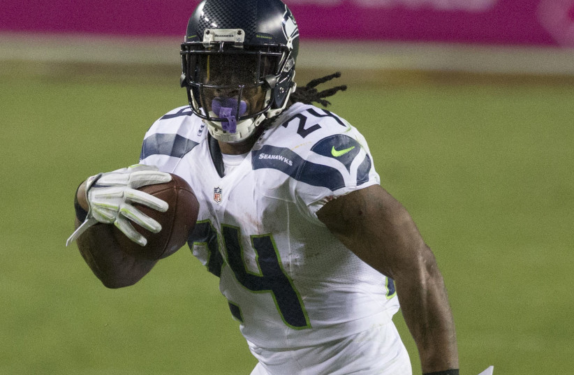  Marshawl Lynch playing with the Seattle Seahawks in 2014 against the Washington Redskins. (credit: Wikimedia Commons)