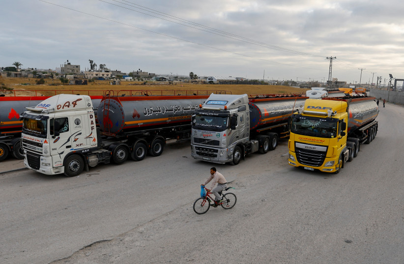  Fuel trucks wait to enter Kerem Shalom which was reopened by Israel after a ceasefire was agreed between Palestinian factions and Israel, in the southern Gaza Strip May 14, 2023.  (credit: REUTERS/IBRAHEEM ABU MUSTAFA)