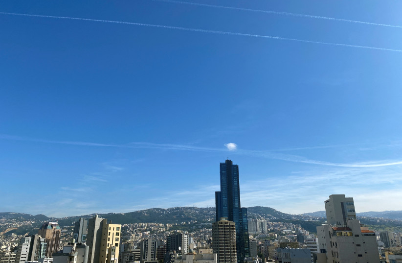  Aircraft leave vapour trails in the sky above Beirut, Lebanon December 10, 2023 (credit: CYNTHIA KARAM/REUTERS)