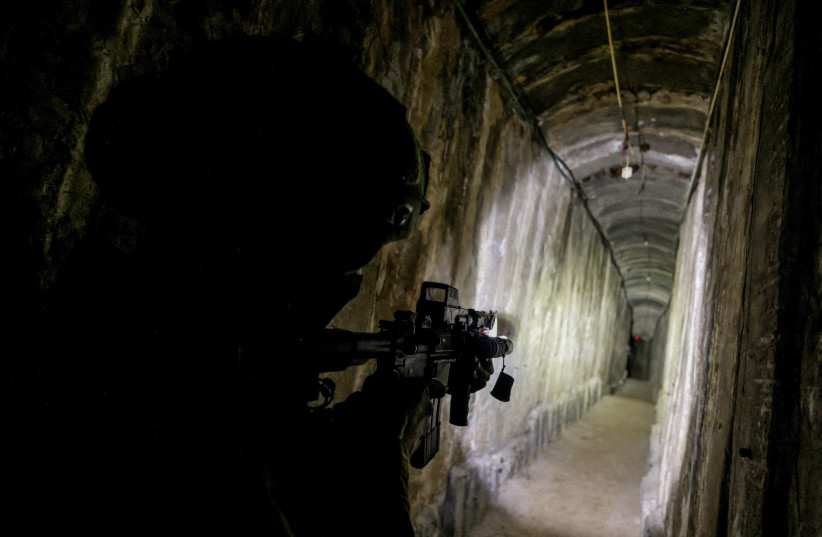  An Israeli soldier secures a tunnel underneath Al Shifa Hospital in Gaza City, amid the ongoing ground operation of the Israeli army against Hamas, in the northern Gaza Strip, November 22, 2023. (credit: REUTERS/Ronen Zvulun)