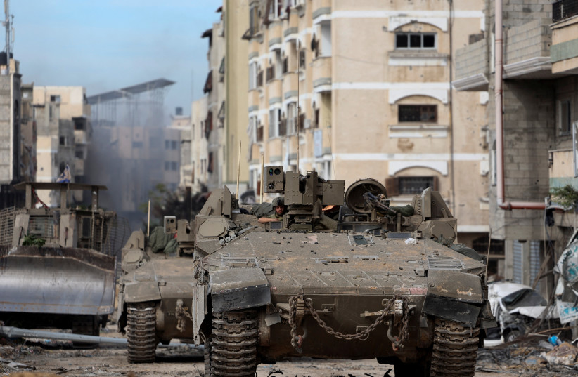  Israeli tanks operate in Gaza City, amid the ongoing ground operation of the Israeli army against Hamas, in the Gaza Strip, November 22, 2023. (credit: REUTERS/Ronen Zvulun)