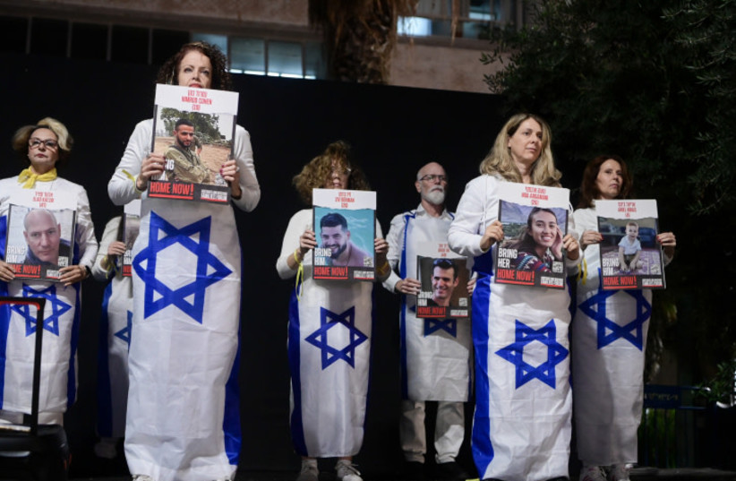  Israelis attend a rally calling for the release of Israelis held kidnapped by Hamas terrorists in Gaza at ''Hostage Square'' in Tel Aviv, December 9, 2023.  (credit: AVSHALOM SASSONI/FLASH90)