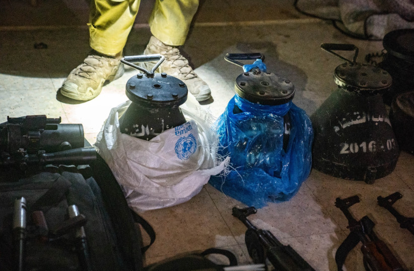 Weapons found in Jabalya, Gaza. Some of them were found in UNRWA bags.  (credit: IDF SPOKESPERSON'S UNIT)