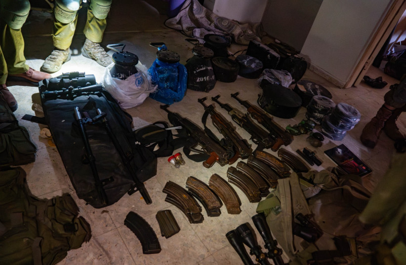 Weapons found by IDF in Jabalya, Gaza. Some of them were found in UNRWA bags. (credit: IDF SPOKESPERSON'S UNIT)