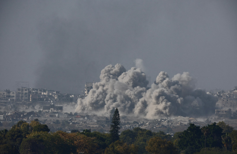  Smoke and debris rises after an Israeli airstrike in central Gaza, amid the ongoing conflict between Israel and the Palestinian Islamist group Hamas, as seen from Israel, December 11, 2023.  (credit: AMIR COHEN/REUTERS)