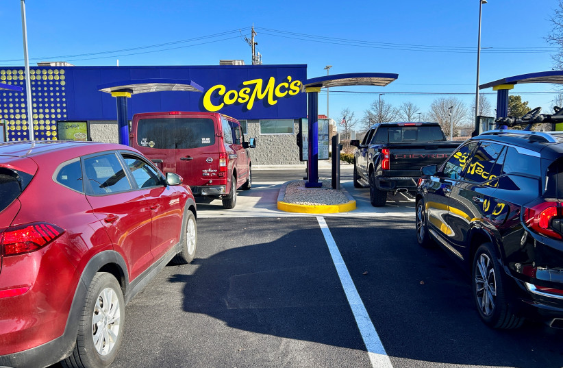  Lines form outside McDonald’s new beverage-led, drive-thru only chain, CosMc’s, during the concept’s secret opening in Bolingbrook, US. December 7, 2023. (credit: REUTERS/ERIC COX)