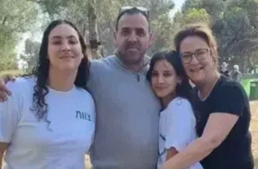  Eli Sharabi with his wife Liane and his daughters Noya and Hiel. Eli is missing, his wife and two daughters were murdered (credit: official site)