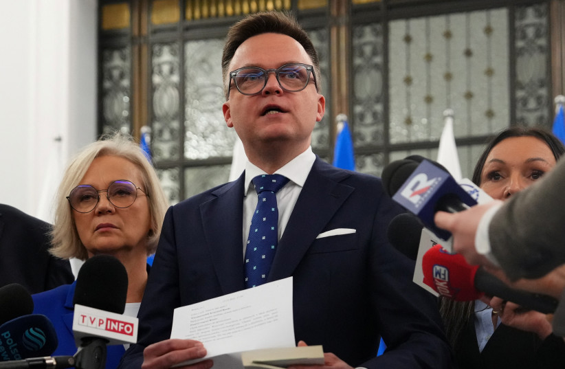 Far-right Polish lawmaker extinguishes Hanukkah candles in parliament ...