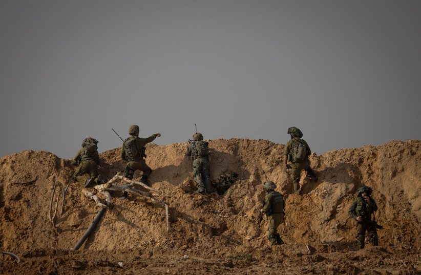 Israeli soldiers at the Jabalya refugee camp, in the northern Gaza Strip, during an Israeli military operation in the Gaza Strip, December 12, 2023 (credit: Chaim Goldberg/Flash90)