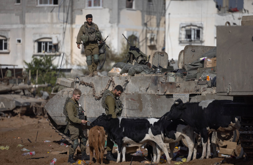  Israeli soldiers at the Jabalya refugee camp, in the northern Gaza Strip, during an Israeli military operation in the Gaza Strip, December 12, 2023 (credit: Chaim Goldberg/Flash90)