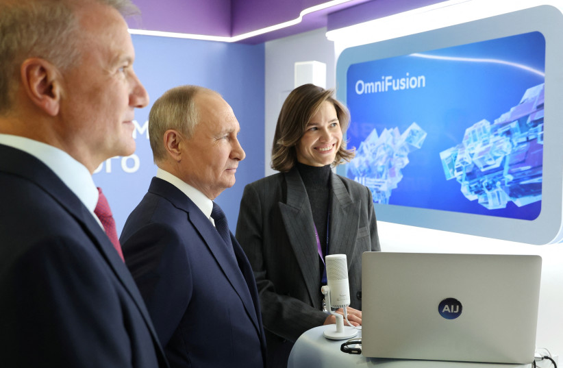  Russian President Vladimir Putin, accompanied by Sberbank CEO and Chairman of the Executive Board German Gref, tours an exhibition as part of the AI Journey 2023, an international artificial intelligence conference, in Moscow, Russia November 24, 2023. (credit: SPUTNIK/MIKHAIL KLIMENTYEV/KREMLIN VIA REUTERS)