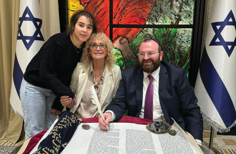  WITH THE scroll at the President’s Residence (above, from L): Menachem Kalmanson’s daughter; Fricker; and Rabbi David Avraham Pressman. (credit: HAIM ZACH/GPO)