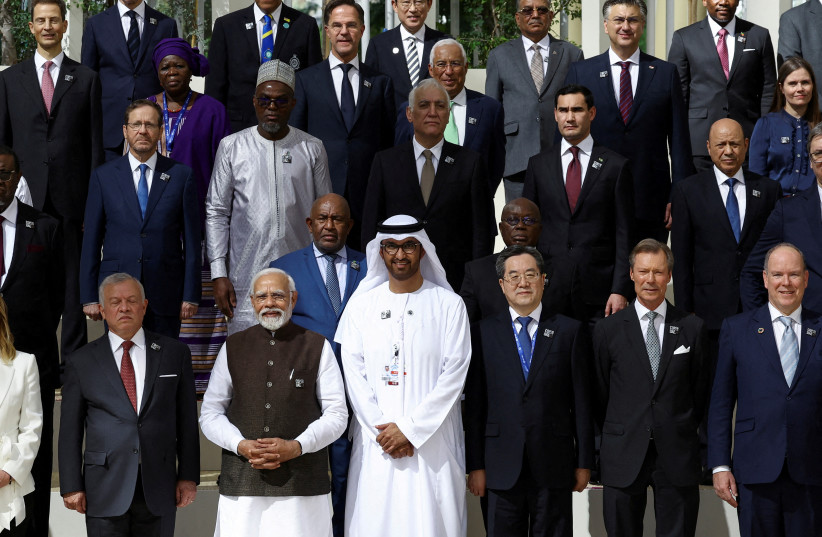   Israel's President Isaac Herzog and other world leaders pose for a photo during the United Nations Climate Change Conference (COP28) in Dubai, United Arab Emirates, December 1, 2023. (credit: REUTERS/AMR ALFIKY)