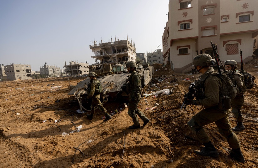  Israeli soldiers at the Jabalya refugee camp, in the northern Gaza Strip, during an Israeli military operation in the Gaza Strip, December 12, 2023. (credit: Chaim Goldberg/Flash90)