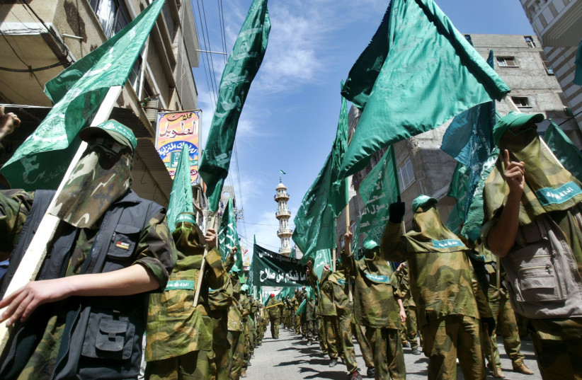   Palestinian militants from Hamas march during a Hamas rally in Nosirat refugee camp in Gaza Strip April 1, 2005. (credit: REUTERS/Ahmed Jadallah AJ/TC)