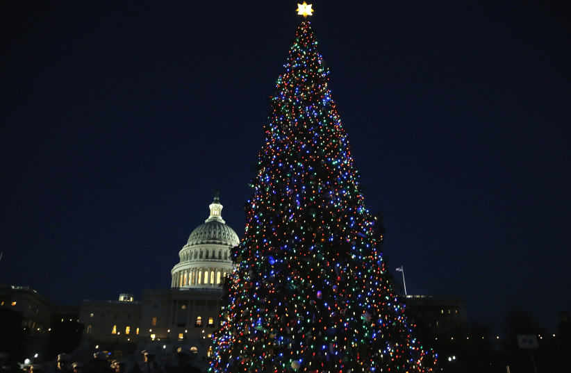  The U.S. Capitol Christmas Tree is lighted in Washington, December 3, 2013. (credit: REUTERS/JONATHAN ERNST)