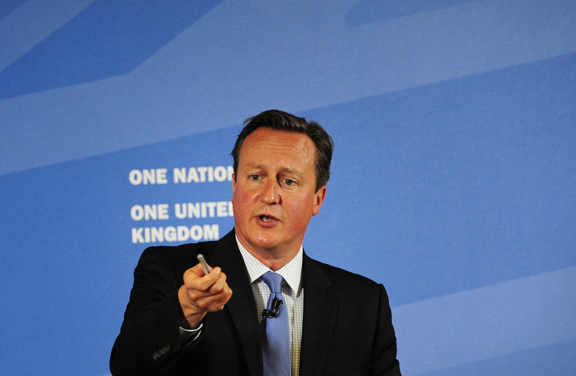  Britain's Prime Minister David Cameron gestures as he speaks in Leeds, Britain September 11, 2015. Cameron said on Friday he was extremely worried about the political crisis in Northern Ireland where the power-sharing government is on the brink of collapse. (credit: REUTERS/John Giles/Pool)