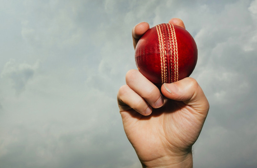  A hand holding a cricket ball. (credit: PakTribune)