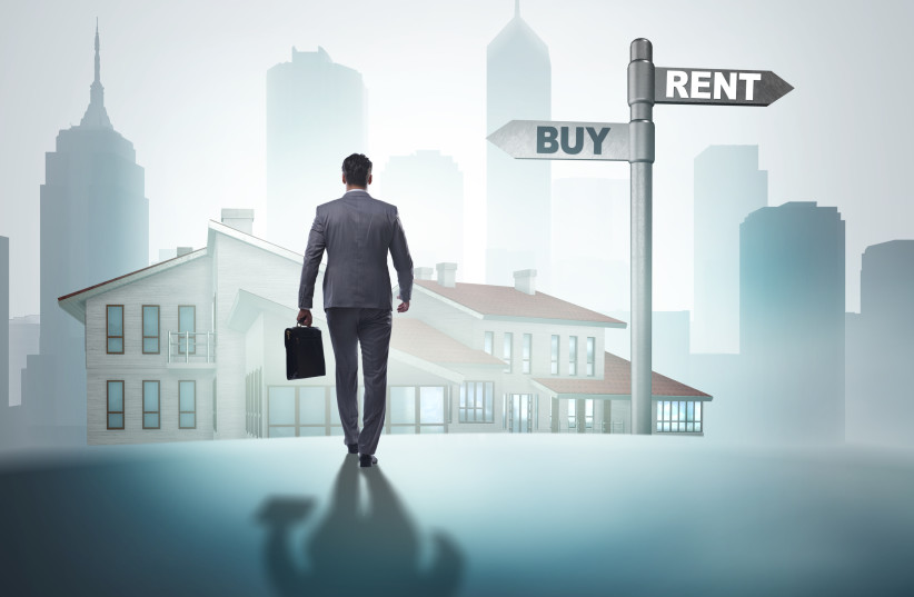  A man is seen at a crossroads between buying and renting real estate in this illustrative image. (credit: INGIMAGE)