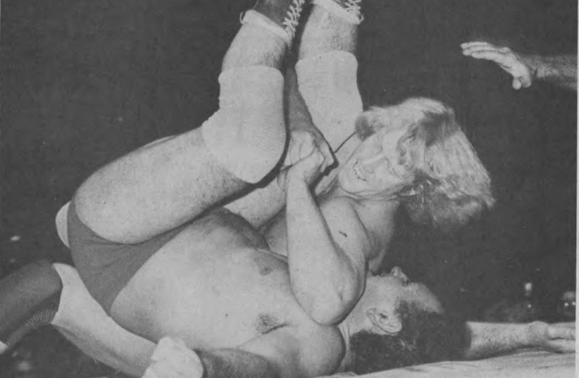  David Von Erich pinning Abe Jacobs during a professional wrestling match in Miami Beach, Florida, December 16, 1981 (credit: Wikimedia Commons)