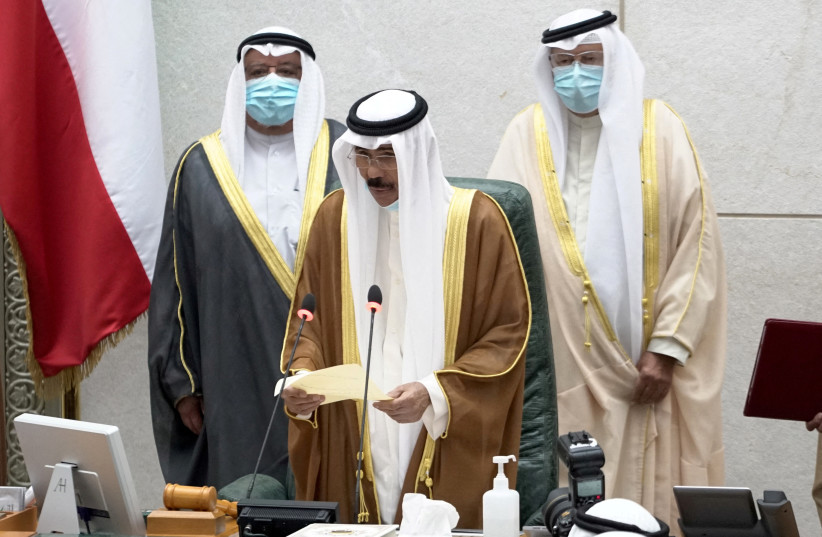  Kuwait's new emir Nawaf al-Ahmad al-Sabah holds a paper as he takes the oath of office at the parliament, in Kuwait City, Kuwait September 30, 2020. (credit: REUTERS/STEPHANIE MCGEHEE)