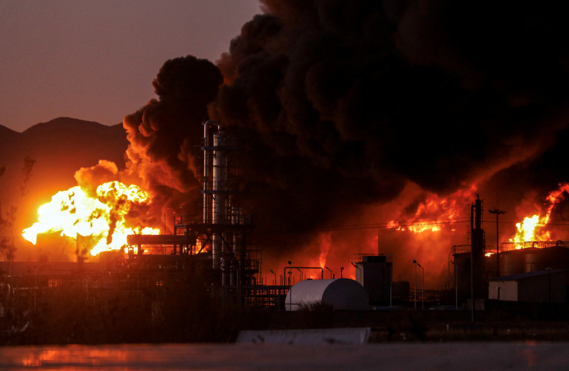A general view of fire at an oil refinery in Birjand, Iran, December 10, 2023. (credit: Mohsen Noferesti/IRNA/WANA Handout via REUTERS)