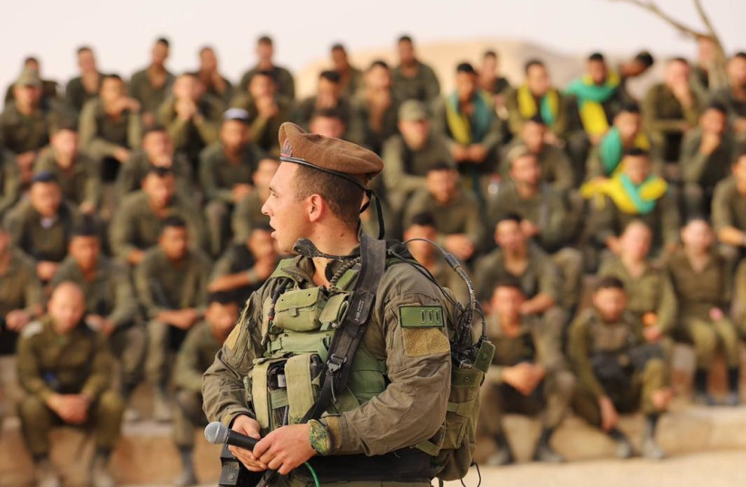  Maj. Roei Meldasi with his soldiers at the completion of their advanced training, December 2023 (credit: IDF SPOKESPERSON'S UNIT)