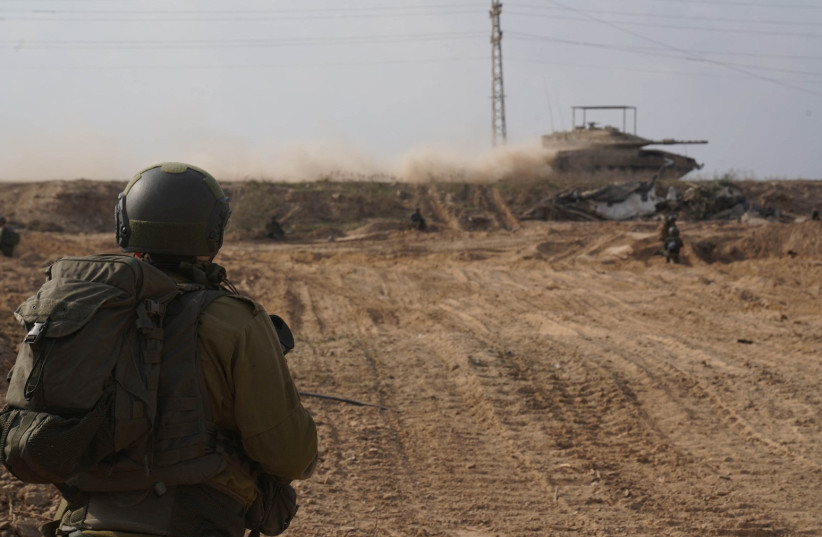  Israeli soldiers operate in the Gaza Strip amid the ongoing conflict between Israel and the Palestinian Islamist group Hamas, in this handout picture released on December 18, 2023. (credit: Israel Defense Forces/Handout via REUTERS)