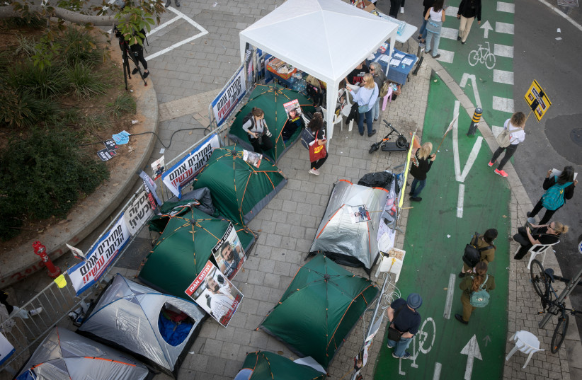  View of protest tents set up by families of Israelis held kidnapped by Hamas terrorists in Gaza, outside Hakirya Base in Tel Aviv, December 18, 2023.  (credit: MIRIAM ALSTER/FLASH90)