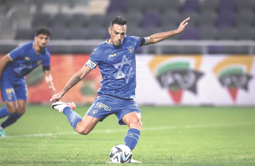  ERAN ZAHAVI once again came to the rescue for Maccabi Tel Aviv, scoring the game-winning goal on a second-half penalty in the yellow-and-blue's 2-1 victory over Maccabi Netanya. (credit: MACCABI TEL AVIV/COURTESY)