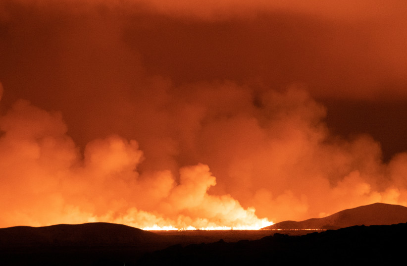 Smoke rises as a volcano erupts along Route 41 in the Reykjanes Peninsula, Iceland December 19, 2023. (credit: REUTERS/Sigurdur Davidsson)