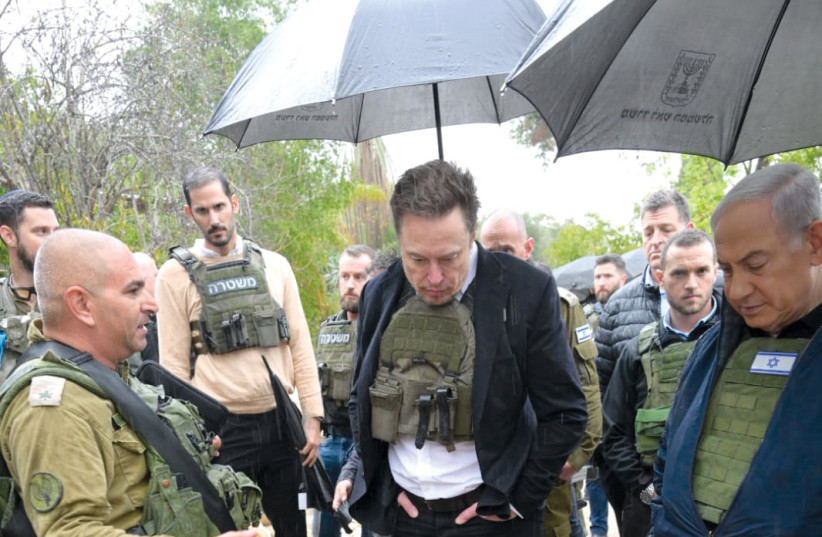  Elon Musk on a tour of Kibbutz Kfar Aza on November 27. (credit: AMOS BEN-GERSHOM/GPO)