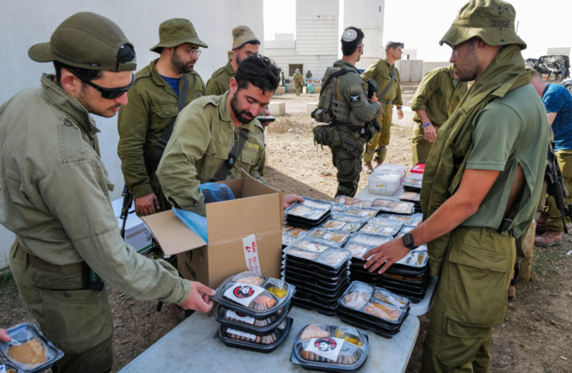  IDF reserve soldiers receive food donations from civilians during a military exercise, Golan Heights on October 24, 2023 (credit: MICHAL GILADI/FLASH90)