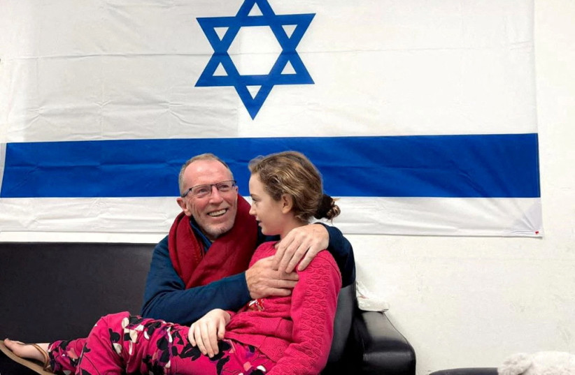  Irish-Israeli girl Emily Hand, who was abducted by Hamas terrorists during the October 7 massacre, meets her father Thomas Hand after being released as part of a hostages-prisoners swap deal between Hamas and Israel amid a temporary truce, at an unknown location in Israel. (credit: Israel Defense Forces/Handout via REUTERS)