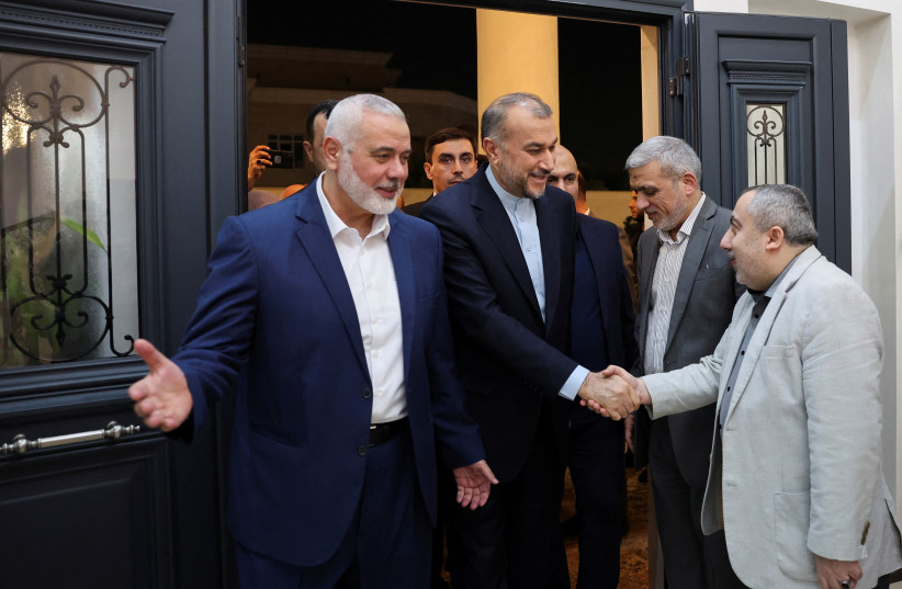  Iran's Foreign Minister Hossein Amir Abdollahian meets with Palestinian group Hamas' top leader, Ismail Haniyeh in Doha, Qatar December 20, 2023.  (credit:  Iran's Foreign Ministry/WANA (West Asia News Agency)/Handout via REUTERS)