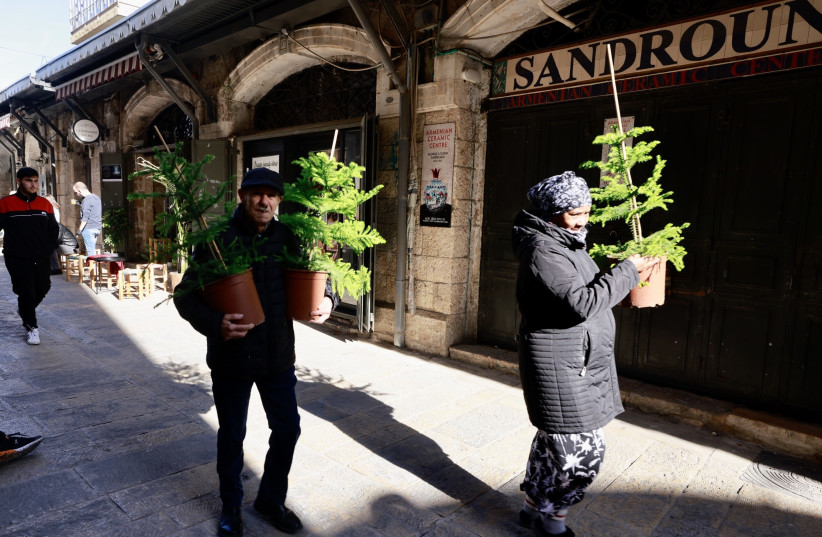  Picking up Christmas trees in the old city. (credit: MARC ISRAEL SELLEM/THE JERUSALEM POST)