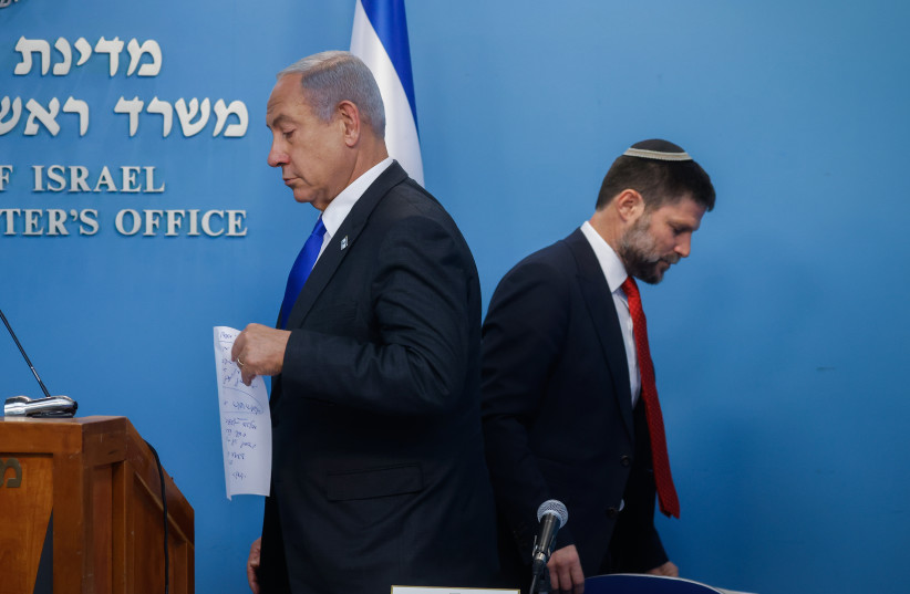 Prime Minister Benjamin Netanyahu gives a press conference with Finance Minister Bezalel Smotrich at the Prime Minister's Office in Jerusalem. January 11, 2023. (credit: OLIVIER FITOUSSI/FLASH90)